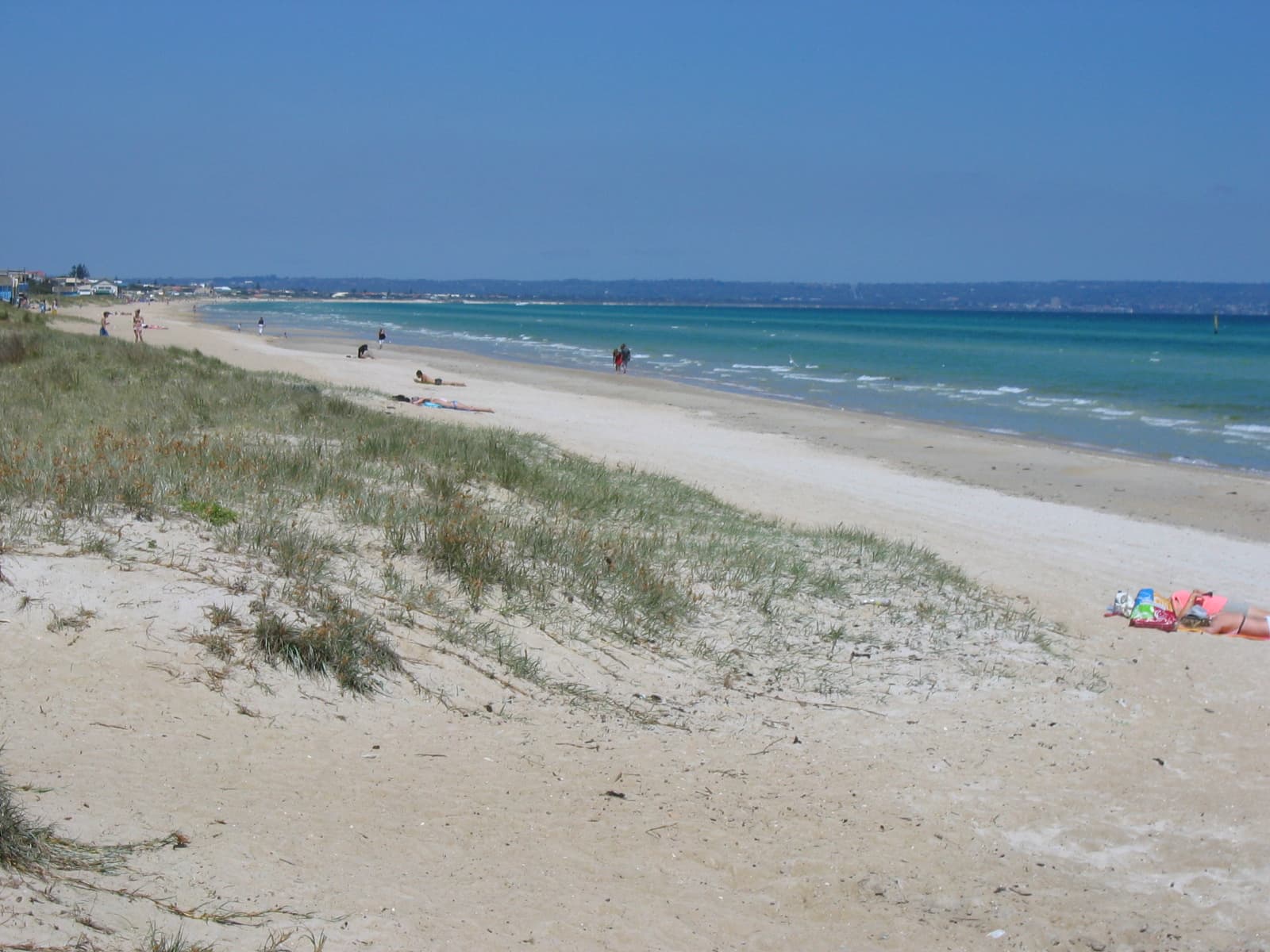 The sweeping Aspendale beach and shallows of Port Phillip on a clear day