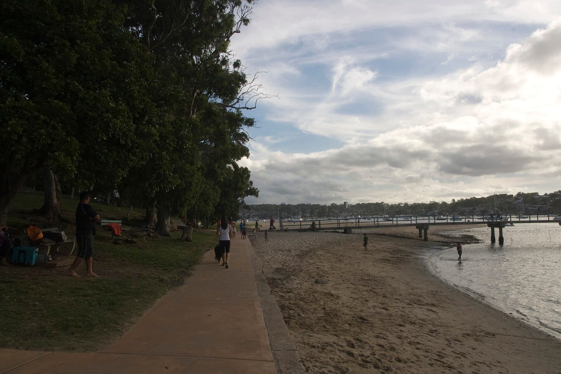 Gunnamatta Bay foreshore at Cronulla with a jetty and moored boats