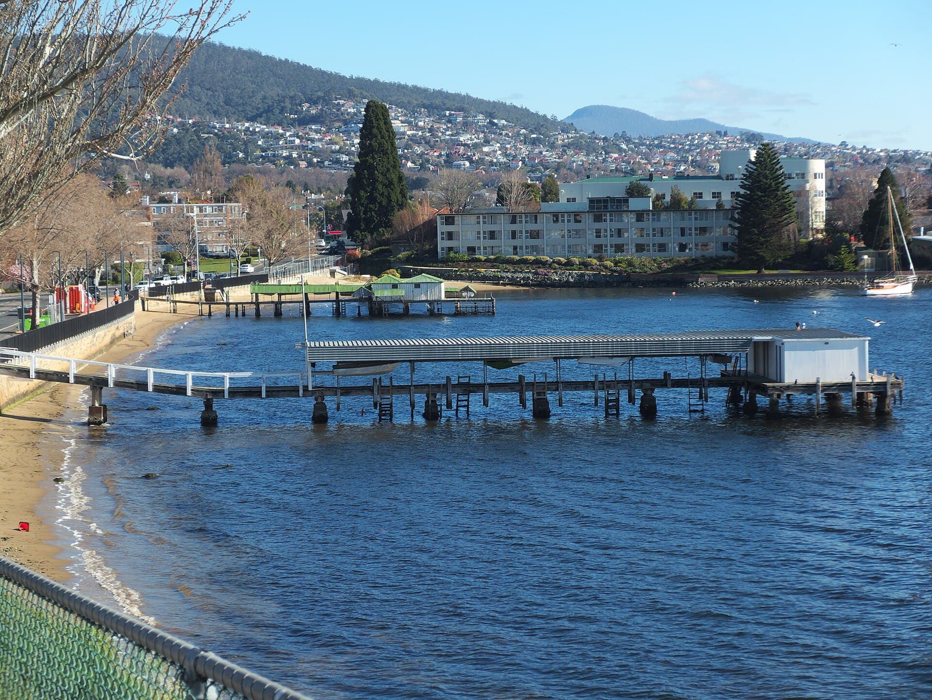 Covered piers on Lords Beach at Sandy Bay, Hobart, on the River Derwent