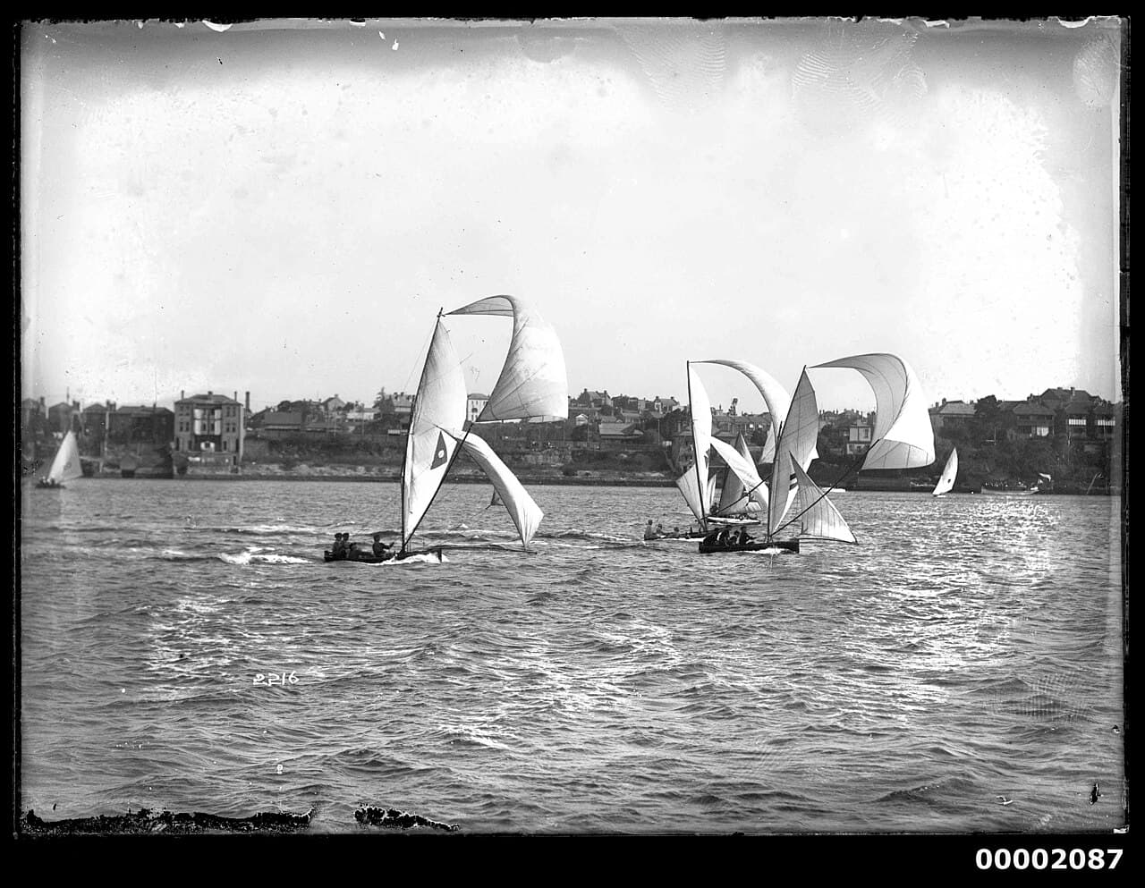 12 or 18 footers with their spinnakers flying, Sydney Harbour